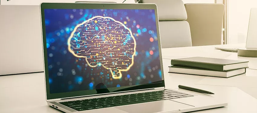 Equipo portátil mostrando cabecera de cursos de Inteligencia Artificial